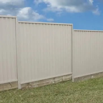 Light Colorbond fence installed along a residential boundary